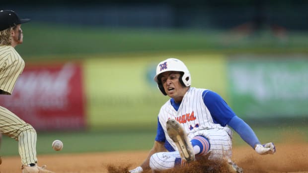 Madison Central's Connor Nation (11) slides into third base. Madison Central and Northwest Rankin played in game 1 of the MHSAA Class 6A Baseball Championship on Thursday, June 4, 2021 at Trustmark Park. Photo by Keith Warren