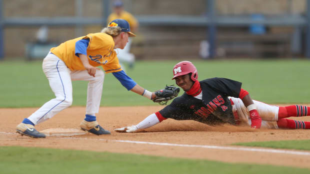 Magee's Brennon McNair (4) is tagged out at third base by Booneville's John Adam White (8). Booneville and Magee played in game 1 of the MHSAA Class 3A Baseball Championship on Tuesday, June 1, 2021 at Trustmark Park. Photo by Keith Warren