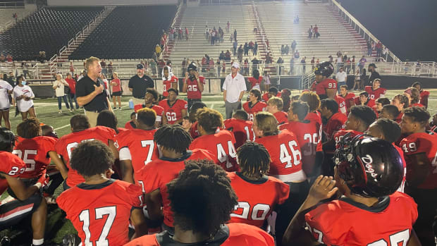 Brandon coach Sam Williams talks to his team following the Bulldogs' 42-28 win over Meridian on Oct. 15, 2021 at Bulldog Stadium in Brandon. (Photo by Tyler Cleveland)