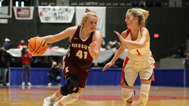 Zoe Essary (41) of the Kossuth Aggies drives the ball against the Belmont Cardinals at the Mississippi Coliseum on March 6, 2021.