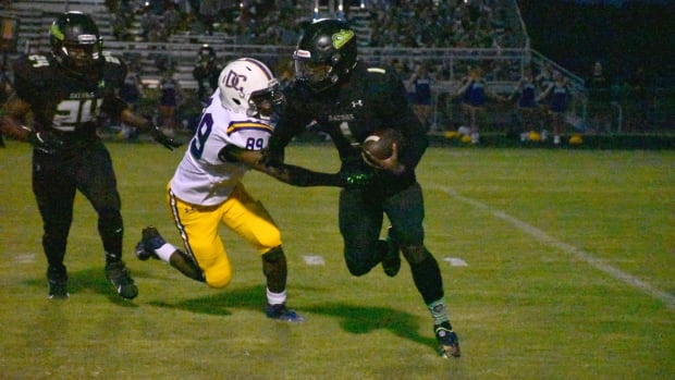 Lake Cormorant quarterback Telvin Amos had four touchdowns in Friday night's win over DeSoto Central. (Photo by Jared Redding)