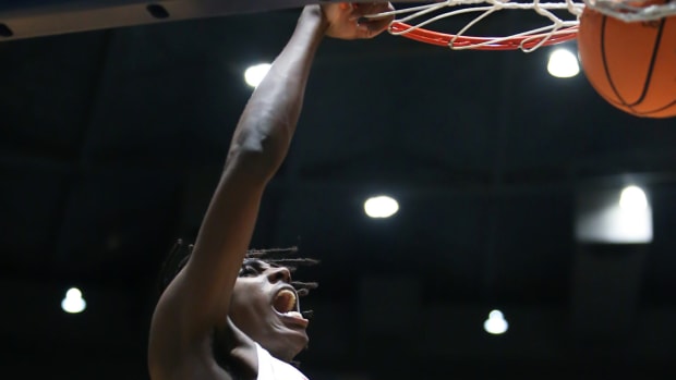 Clinton's Kimani Hamilton (5) dunks after making a steal in the second quarter. Clinton and Harrison Central played in an MHSAA Class 6A basketball semifinal basketball game at Mississippi Coliseum on Wednesday, March 3, 2020. Photo by Keith Warren