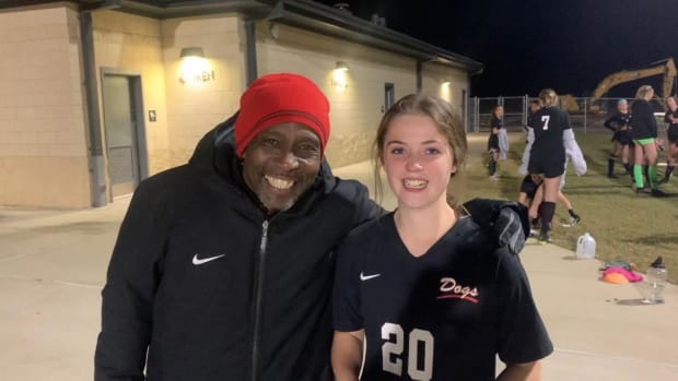 Brandon soccer coach Jeremy Shortt poses for a photo with Carleigh King after King scored two goals to help the Bulldogs beat Oak Grove. (Photo by Dylan Tribolet)
