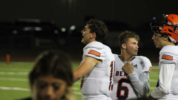 Bridgeland senior quarterback Conner Weigman cheers on his teammates during the second half of the Bears' season-opening win against Klein Cain Saturday night at Klein Memorial Stadium. (Andrew McCulloch | SBLive Texas)