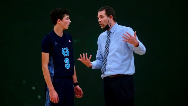 Gig Harbor boys basketball coach Billy Landram talks to son, Will