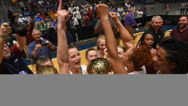 The Biggersville girls basketball team celebrates after winning the 2022 MHSAA 1A State Basketball Championship at the Mississippi Coliseum on Thursday, March 3.