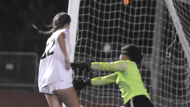 Bishop Moore's Pierson Rawlin puts in a rebound past Winter Park backup goalkeeper Marley Gerber for the Hornets' first goal. Rawlin also had an assist in the Hornets' 4-0 victory Wednesday.