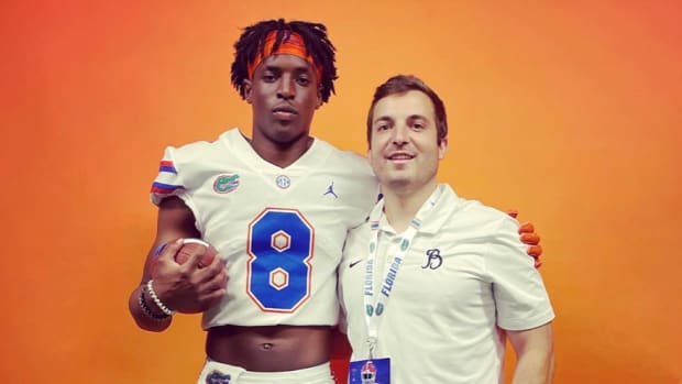 Baker junior Josh Flowers poses for a photo with his offensive coordinator Chase Calcagni during a visit to the University of Florida.