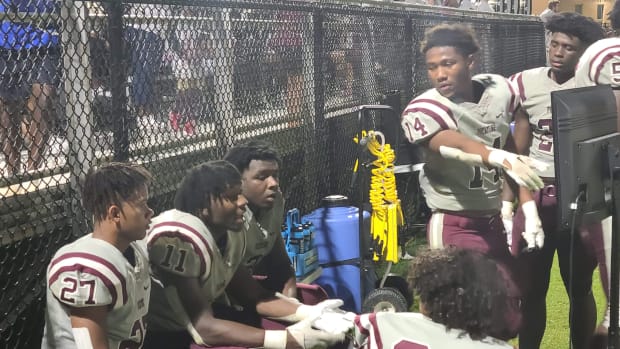 Picayune defenders discuss strategy on the sidelines during Friday night's 28-7 win over Jefferson Davis County.