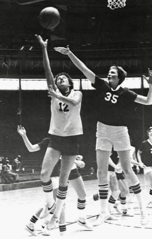 WIAA Assistant Executive Director Cindy Adsit (left) goes up for a layup playing for Montana State's women's basketball program in the 1970s.