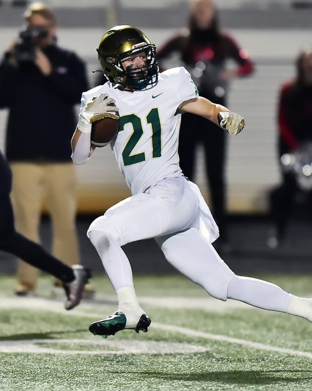 Cole Gamble rushed for 193 yards and three touchdowns to lead Mountain Brook to a 28-7 victory over Muscle Shoals in the semifinals of the Class 6A Alabama high school football playoffs on November 25, 2022.