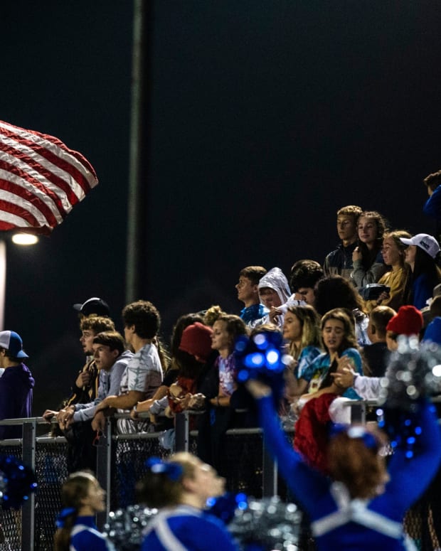 Clear Creek-Amana fans cheer on their team in a during a Class 3A varsity football game at Liberty High School in North Liberty, Iowa.