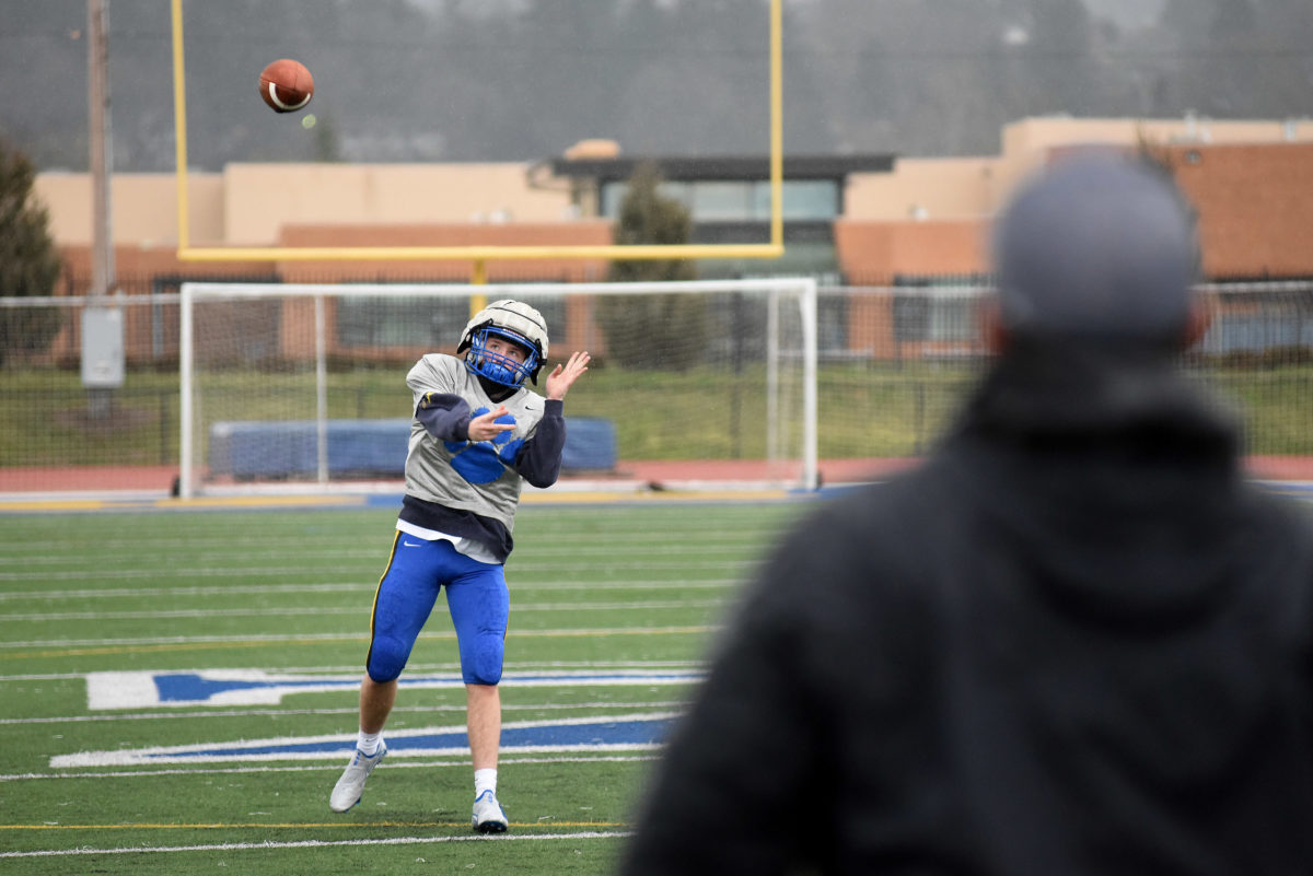 The Newberg Tigers football team practices Friday, Feb. 19, 2020 in Newberg, Ore.
