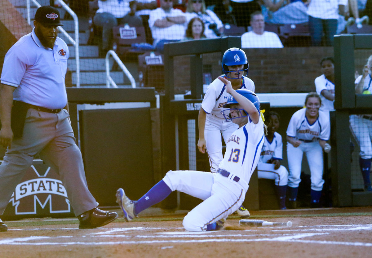 Booneville High School's Caroline Thompson (13) scores a run. Booneville and Raleigh played in game one of the MHSAA Class 3A Baseball Championship at Mississippi State University on Wednesday, May 12, 2021. Photo by Keith Warren