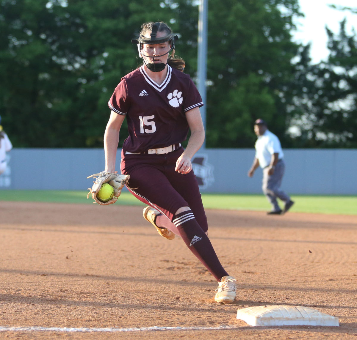Raleigh High School's Hayley  Revette  (15) touches first base for a put-out in the second inning. Booneville and Raleigh played in game one of the MHSAA Class 3A Baseball Championship at Mississippi State University on Wednesday, May 12, 2021. Photo by Keith Warren
