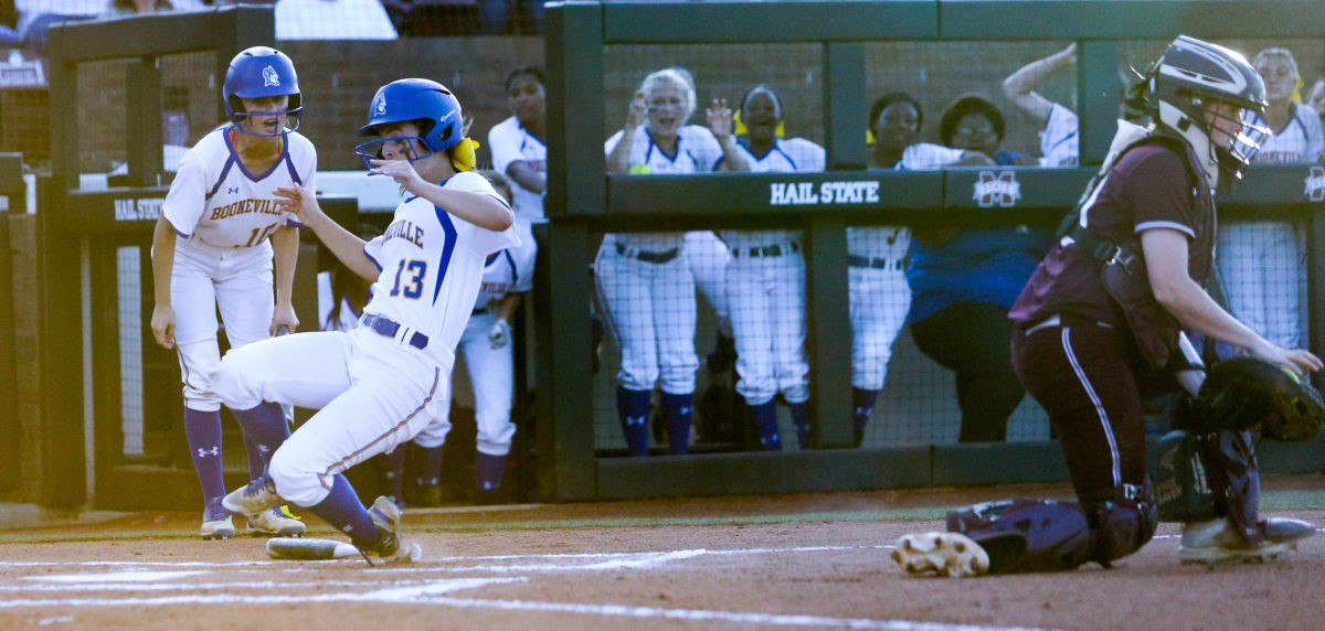 Booneville High School's Caroline Thompson (13) slides into home plate. Booneville and Raleigh played in game one of the MHSAA Class 3A Baseball Championship at Mississippi State University on Wednesday, May 12, 2021. Photo by Keith Warren
