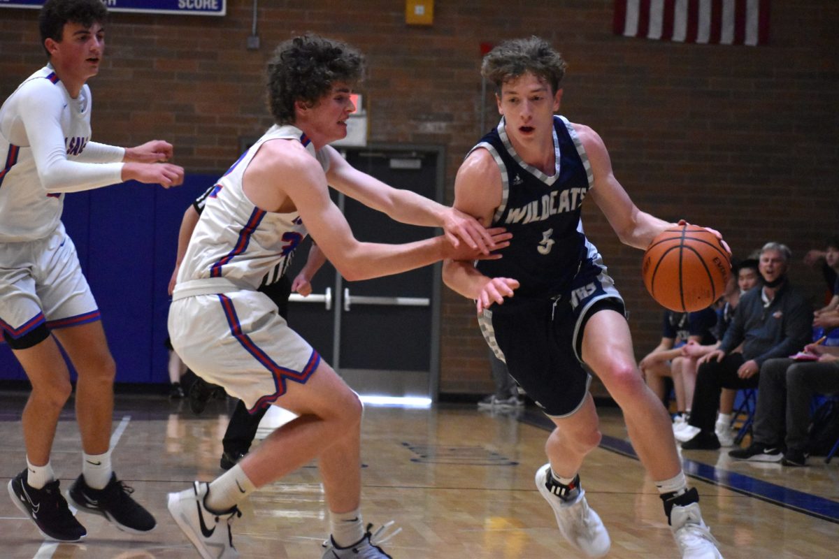 Wilsonville's Riley Scanlan turns the corner on a drive in the first half. He finished with a game-high 33 points.