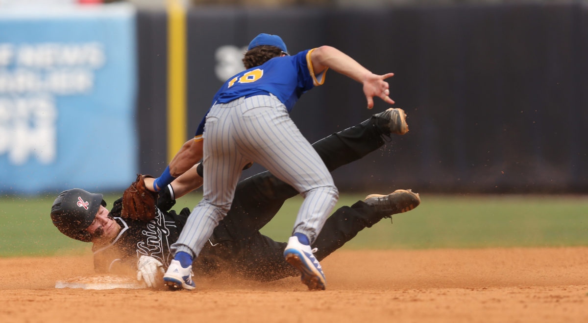 Sumrall's Marshall Phillips (16) tags out West Lauderdale's Brett Busbea (1) at second base. West Lauderdale and Sumrall played in game 1 of the MHSAA Class 4A Baseball Championship on Friday, June 4, 2021 at Trustmark Park. Photo by Keith Warren