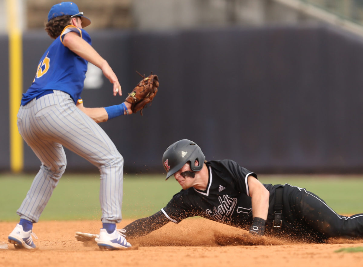 Sumrall's Marshall Phillips (16) tags out West Lauderdale's Brett Busbea (1) at second base. West Lauderdale and Sumrall played in game 1 of the MHSAA Class 4A Baseball Championship on Friday, June 4, 2021 at Trustmark Park. Photo by Keith Warren