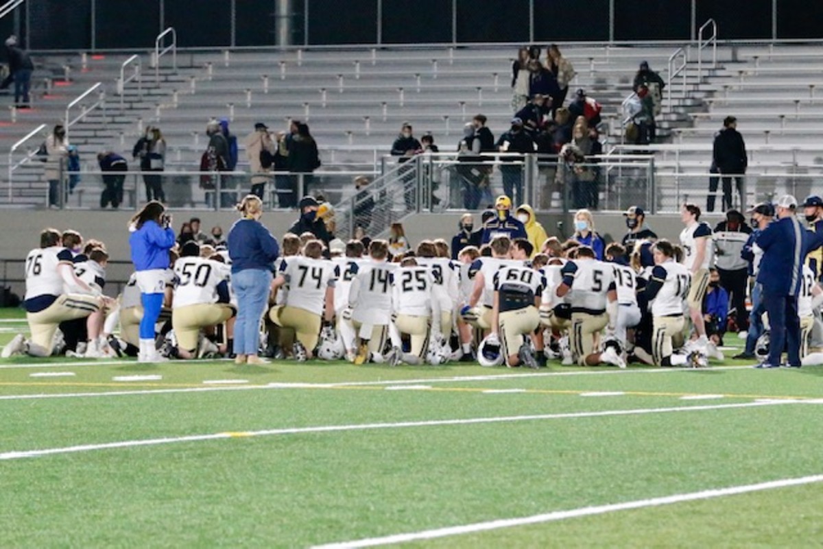 The Mead football team gathers after the Battle of the Bell on April 3. (Photo by Erik Smith)