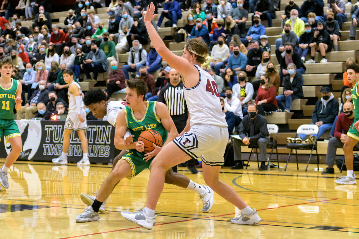 The Tualatin Timberwolves varsity boys basketball team hosted the West Linn Lions at Tualatin High School.  The timberwolves come away with a 69-58 win in their OSAA 6A Three Rivers League season opener.