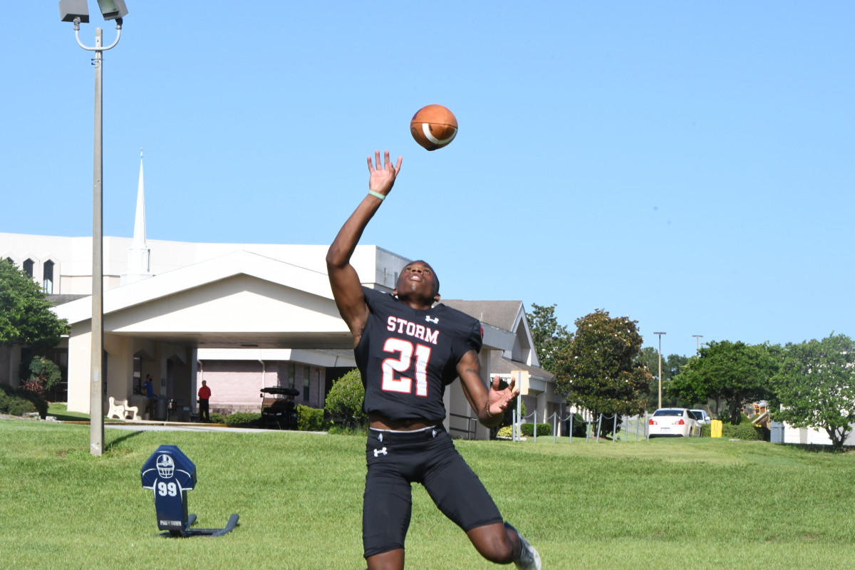 Victory Christian cornerback Marlon McClendon (21) shows off his athletic ability going up for a pass during the Storms media day in Lakeland.